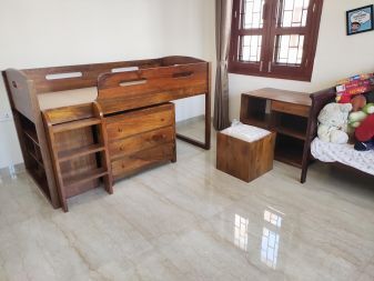 wooden bunk beds with storage and study table